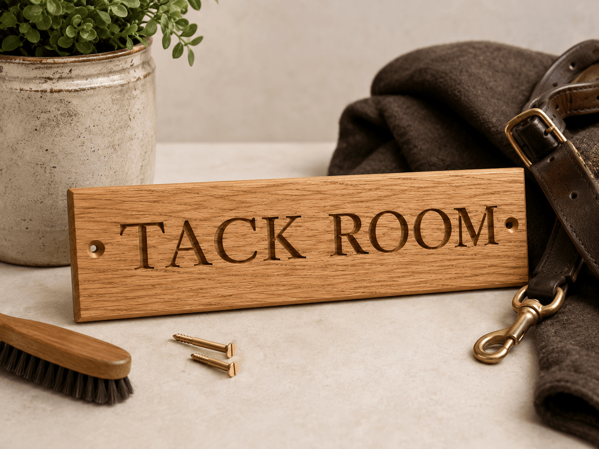 Engraved lettering and oak grain detail on a tack room sign